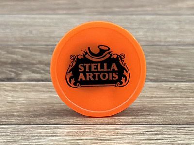 oranje jetons met zwarte bedrukking voor Stella Artois